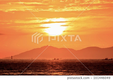 Morning sun climbing Mt. Zao and fishing boats out for fishing Morning sun climbing Mt. Zao and fishing boats out for fishing 101446049