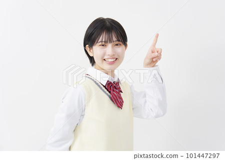 High school girl pointing to the right white background 101447297