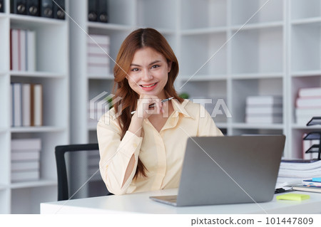 Asian Business person makes analysis and research financial report at office, analyzes profits. Accountant checks status of financial Asian Business person makes analysis and research financial report at office, analyzes profits. Accountant checks status of financial 101447809