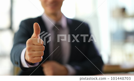 Manager businessman showing gesture thumb up at work in office closeup Manager businessman showing gesture thumb up at work in office closeup 101448703
