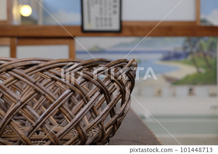 An image of a public bath (a clothes basket with a painting of Mt. Fuji in the background) 101448713