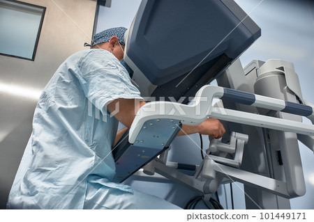 The surgeon is at the computer robot in a special control module, the medical robot is under the control of the doctor at a distance through the monipulator. Robotic surgery without incision 101449171