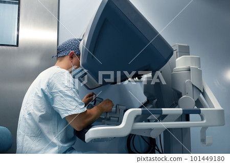 The surgeon is at the computer robot in a special control module, the medical robot is under the control of the doctor at a distance through the monipulator. Robotic surgery without incision 101449180