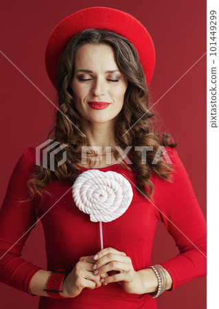 relaxed stylish 40 years old woman in red dress and beret relaxed stylish 40 years old woman in red dress and beret 101449299