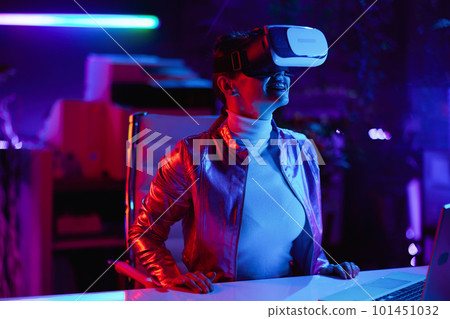 smiling woman in virtual reality goggles in office smiling woman in virtual reality goggles in office 101451032