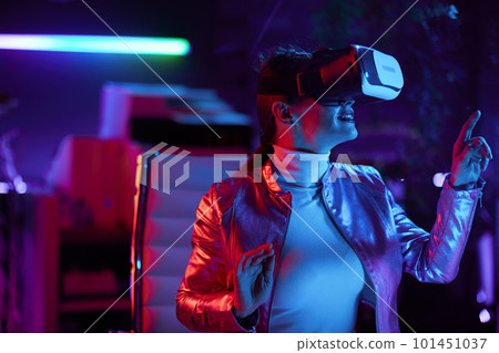 curious woman designing virtual reality in office 101451037