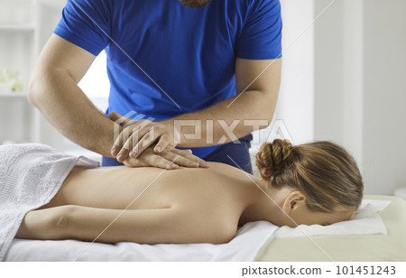 Physiotherapist massage female patient in spa 101451243