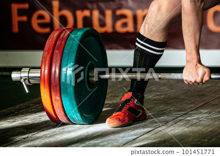 part barbell and body powerlifter stand on wooden floor, powerlifting competition deadlift 101451771