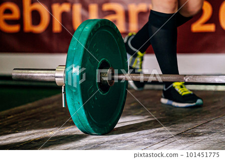 part barbell and legs powerlifter on wooden floor, powerlifting competition deadlift part barbell and legs powerlifter on wooden floor, powerlifting competition deadlift 101451775