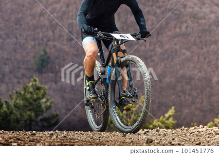 close-up cyclist riding mountain bike in cross-country cycling, wheels sports mountainbike close-up cyclist riding mountain bike in cross-country cycling, wheels sports mountainbike 101451776