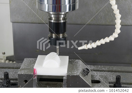 The  CNC milling machine cutting the nylon 6 material part with ball end mill tool. 101452042