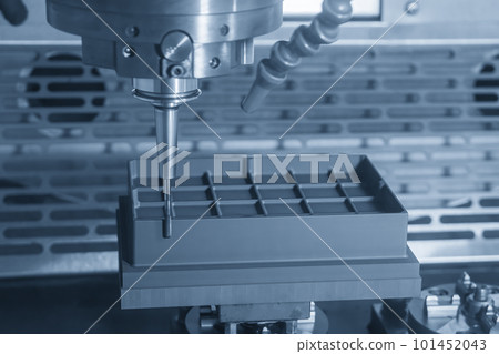 The CNC milling machine rough cutting the graphite electrode parts with solid ball end mill. 101452043
