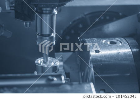 The CNC milling machine hole cutting the automotive parts by drill tools. The CNC milling machine hole cutting the automotive parts by drill tools. 101452045