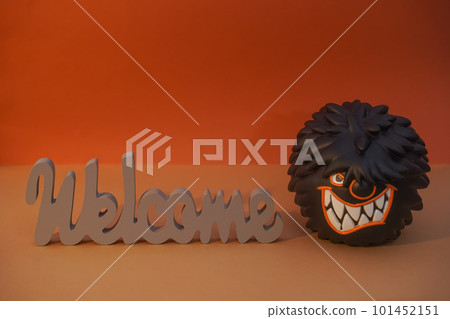 WELCOME wood inscription and shaggy hungry monster with huge teeth copyspace. Humorous invitation. April Fools Day joke WELCOME wood inscription and shaggy hungry monster with huge teeth copyspace. Humorous invitation. April Fools Day joke 101452151