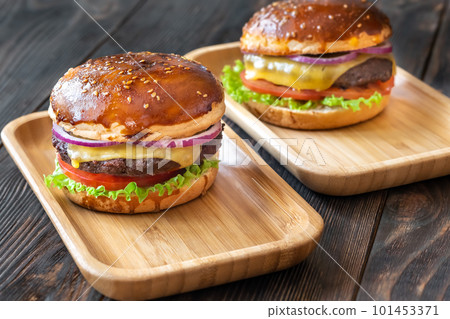 Burgers on the wooden plates Burgers on the wooden plates 101453371