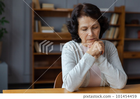 Sad tired ill sick lonely disappointed older senior woman sitting at home alone. Unhappy mature grandmother experiencing grief relative death bad news. Stressed elder lady suffering from loneliness Sad tired ill sick lonely disappointed older senior woman sitting at home alone. Unhappy mature grandmother experiencing grief relative death bad news. Stressed elder lady suffering from loneliness 101454459