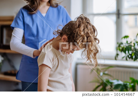 Little girl doing exercise with a nurse. Little girl doing exercise with a nurse. 101454667