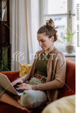Young woman with digital tablet resting in her apartment. Young woman with digital tablet resting in her apartment. 101454710