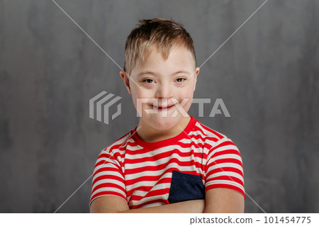 Portrait of little boy with down syndrome, studio shoot. 101454775