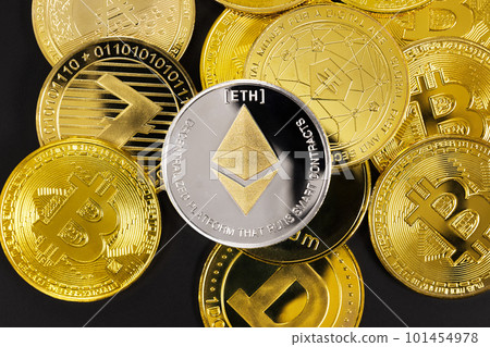 Close-up of Ethereum on top of various golden cryptocurrencies 101454978
