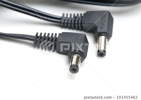Cable and plug for charging video cameras, phones and other electronic devices on a white background 101455462
