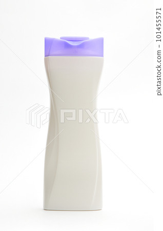 White plastic bottle for shampoo with a purple cap on a white background 101455571
