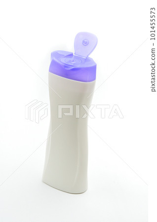 White plastic bottle for shampoo with a purple cap on a white background 101455573