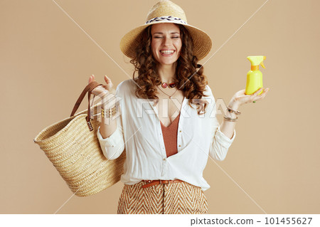 happy housewife in blouse and shorts isolated on beige happy housewife in blouse and shorts isolated on beige 101455627