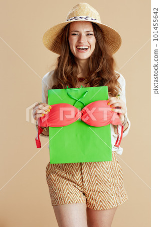 happy elegant female in blouse and shorts isolated on beige happy elegant female in blouse and shorts isolated on beige 101455642