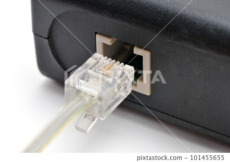 Cable with Rj 11 plug for a telephone line on a white background Cable with Rj 11 plug for a telephone line on a white background 101455655