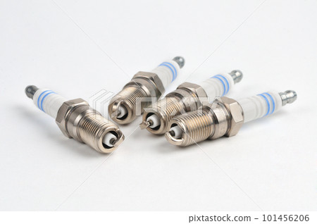 Car spark plug on isolated white background 101456206