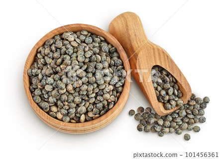 raw french green lentils in wooden bowl isolated on white background. Top view. Flat lay 101456361