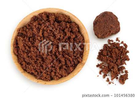 Dark muscovado sugar or Barbados sugar in wooden bowl isolated on white background. Top view. Flat lay Dark muscovado sugar or Barbados sugar in wooden bowl isolated on white background. Top view. Flat lay 101456380