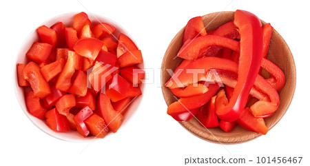 slices of red sweet bell pepper in wooden bowl isolated on white background. Top view. Flat lay slices of red sweet bell pepper in wooden bowl isolated on white background. Top view. Flat lay 101456467