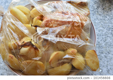 Oven-fried chicken with potatoes. Chicken with a delicious crust. Fried potatoes. Oven-fried chicken with potatoes. Chicken with a delicious crust. Fried potatoes. 101456608