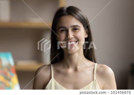 Happy beautiful young Hispanic artist girl standing in creative studio Happy beautiful young Hispanic artist girl standing in creative studio 101456878