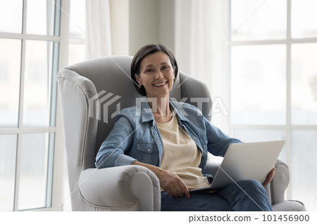 Happy pretty mature freelance professional woman home portrait Happy pretty mature freelance professional woman home portrait 101456900