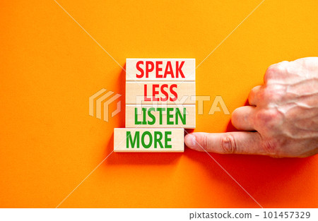 Speak less listen more symbol. Concept words Speak less listen more on wooden block. Beautiful orange table orange background. Motivational business speak less listen more concept. Copy space. 101457329