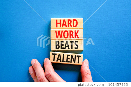 Hard work beats talent symbol. Concept words Hard work beats talent on wooden block. Beautiful blue table blue background. Motivational business hard work beats talent concept. Copy space. 101457333