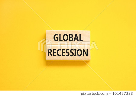 Global recession symbol. Concept words Global recession on wooden blocks. Beautiful yellow table yellow background. Business and global recession concept. Copy space. Global recession symbol. Concept words Global recession on wooden blocks. Beautiful yellow table yellow background. Business and global recession concept. Copy space. 101457388