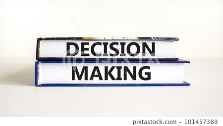 Decision making symbol. Concept words Decision making on books. Beautiful white table white background. Business and decision making concept. Copy space. Decision making symbol. Concept words Decision making on books. Beautiful white table white background. Business and decision making concept. Copy space. 101457389