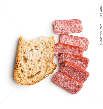 Smoked sausage. Sliced salami and bread isolatd on white background. 101458078