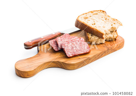 Smoked sausage. Sliced salami and bread isolatd on white background. Smoked sausage. Sliced salami and bread isolatd on white background. 101458082
