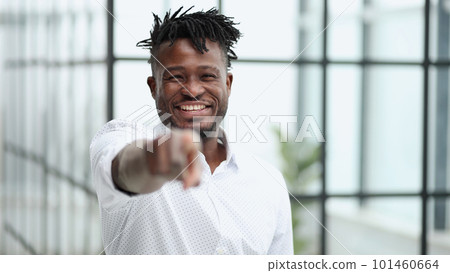 Handsome happy young man pointing at camera 101460664