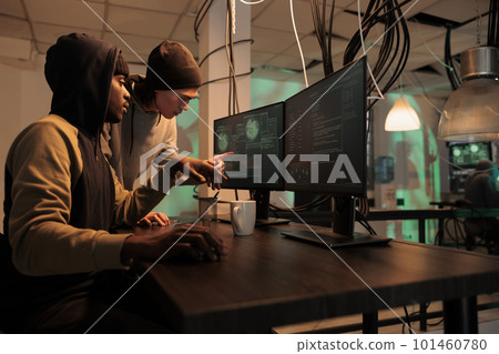 Cyberattack, hackers team stealing government privacy information, data breach. Cybercrime, diverse internet criminals hacking computer system, programming malicious software 101460780