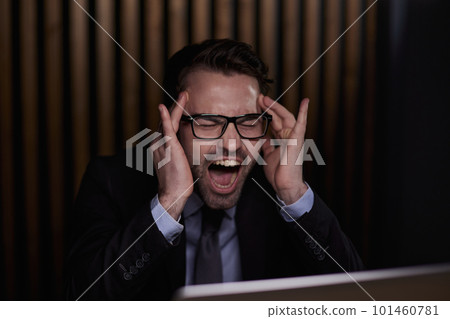 business, deadline and stress people concept - stressed businessman with laptop working at office business, deadline and stress people concept - stressed businessman with laptop working at office 101460781