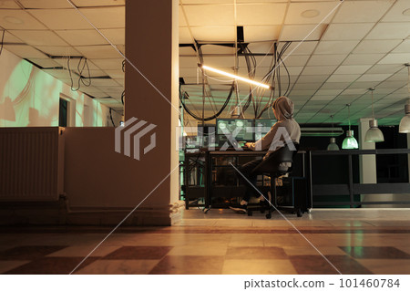 Successful cyberattack caused by team of thieves, planting trojan virus to hack computer network at night. Happy people breaking into banking account at night time, using software. 101460784