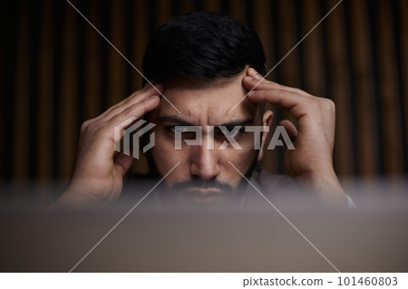 businessman working on laptop in modern office lobby space. 101460803