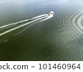 A drone view flying over a boat towing children on tubes 101460964
