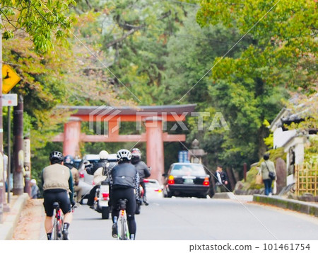 A bicycle running in front of the torii gate at a tourist spot A bicycle running in front of the torii gate at a tourist spot 101461754